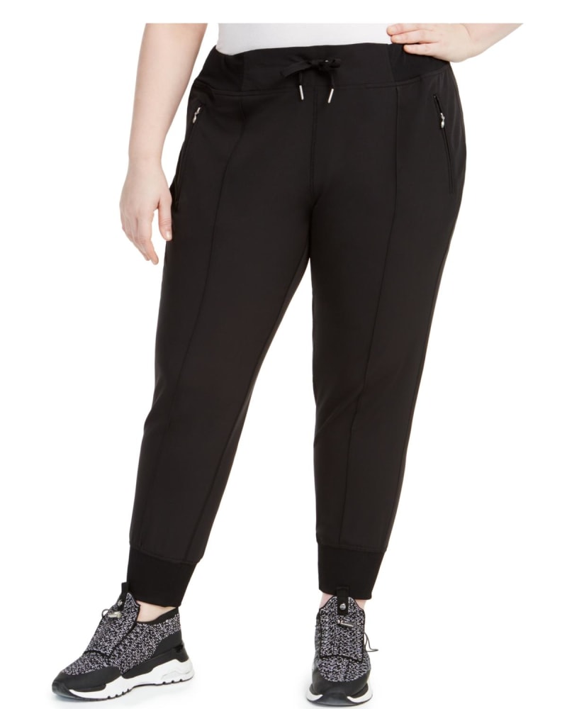 Front of a model wearing a size 2X Calvin Klein Women's Sweatpants Fitness Jogger Pants Black 2X in Black by Calvin Klein. | dia_product_style_image_id:306330